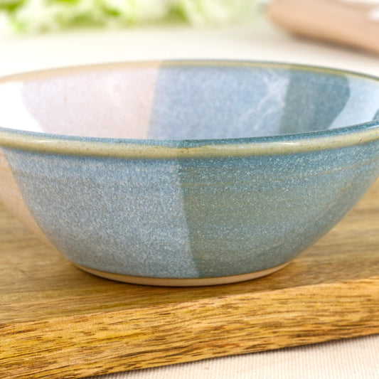 Close-up of double-dipped Coastal Blue and White Sea Smoothed Pebble glazes on a wheel-thrown stoneware snack bowl