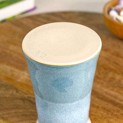 Handmade wheel-thrown stoneware bud vase in Coastal Blue and white, double-dipped with a glazed finish and artisan mark stamped base, British studio pottery.