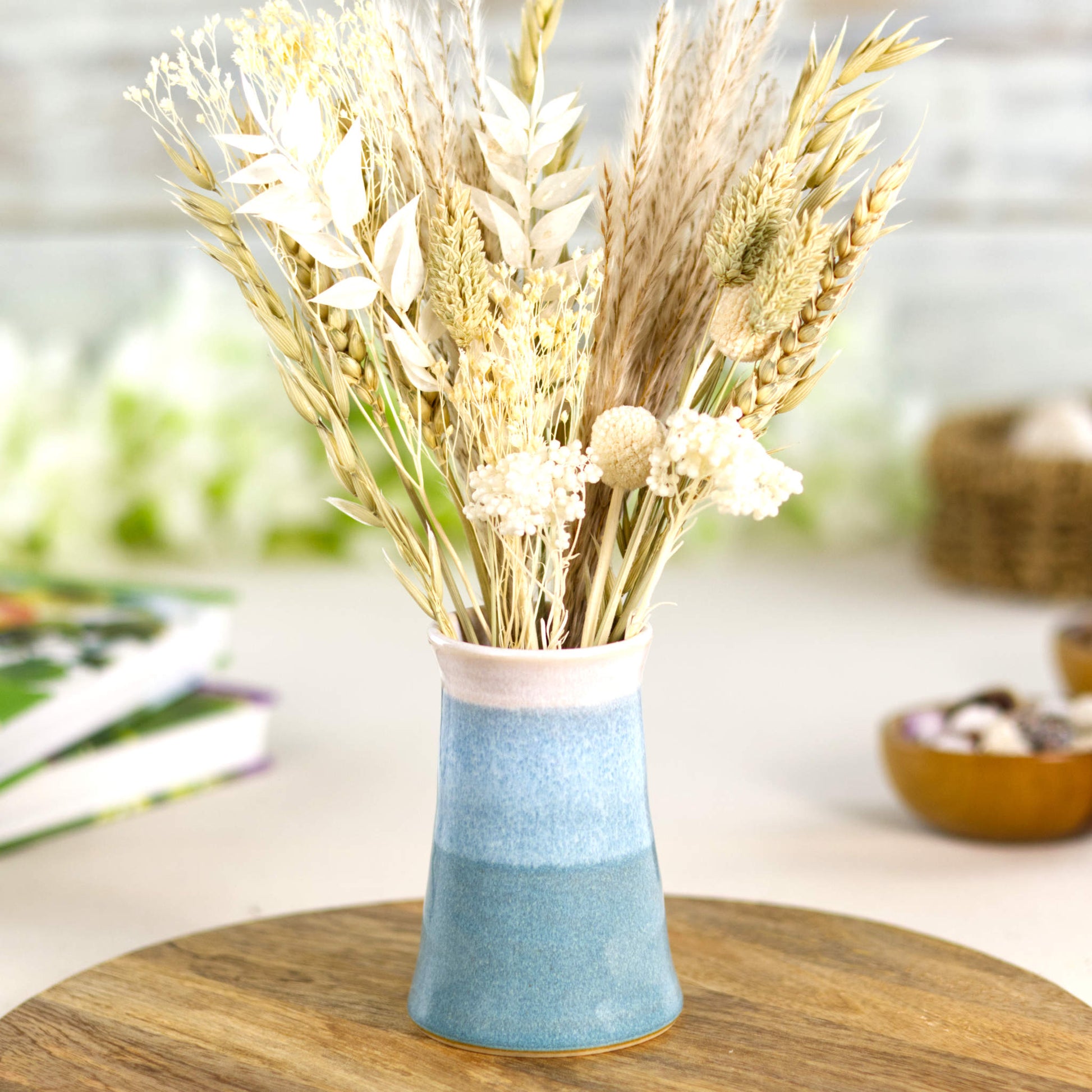 Coastal Blue and white double-dipped pottery bud vase with neutral dried grasses, ideal for Scandi and coastal-inspired interiors.