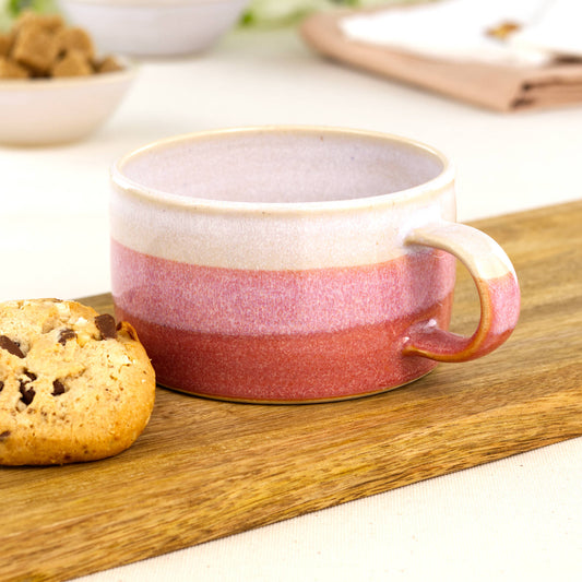 White and Coral handmade cappuccino cup beside biscuit on oak board, artisan stoneware cup for flat white coffee moments