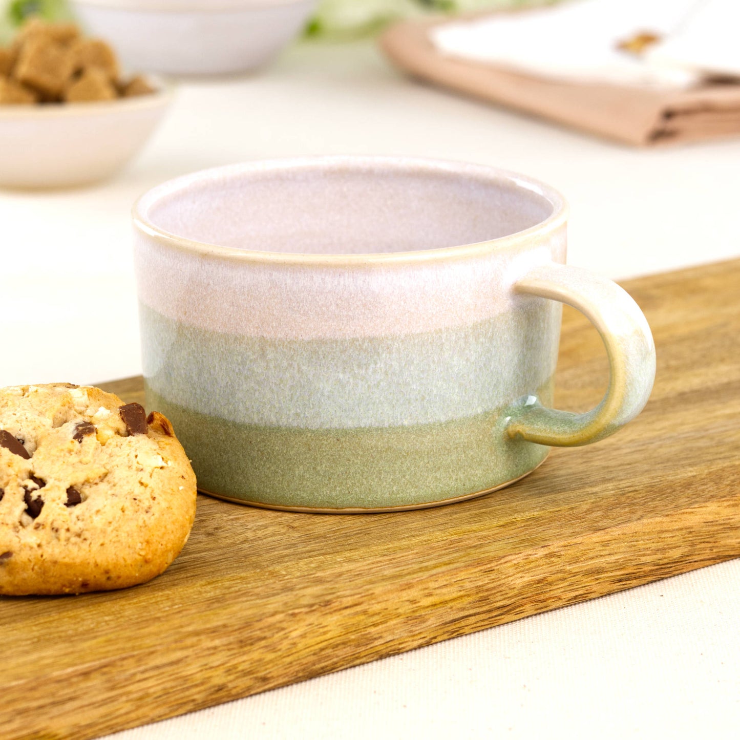 White and Pale Green handmade cappuccino cup on wooden board with biscuit, artisan stoneware coffee mug for weekend flat whites