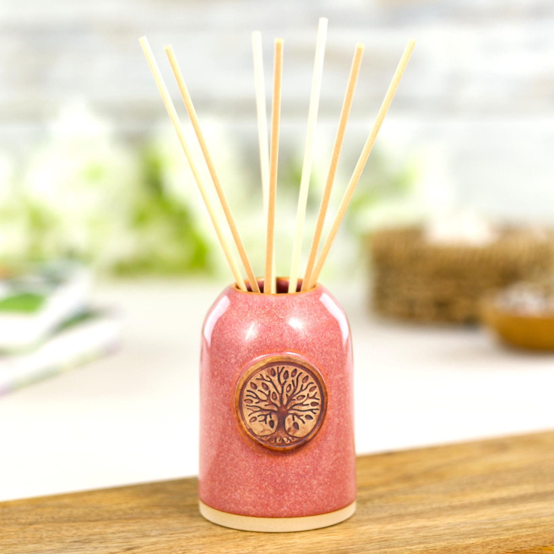 Handmade coral reed diffuser with natural reeds for uplifting home fragrance and cosy bathroom decor