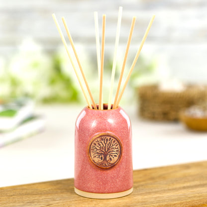 Handmade coral reed diffuser with natural reeds for uplifting home fragrance and cosy bathroom decor