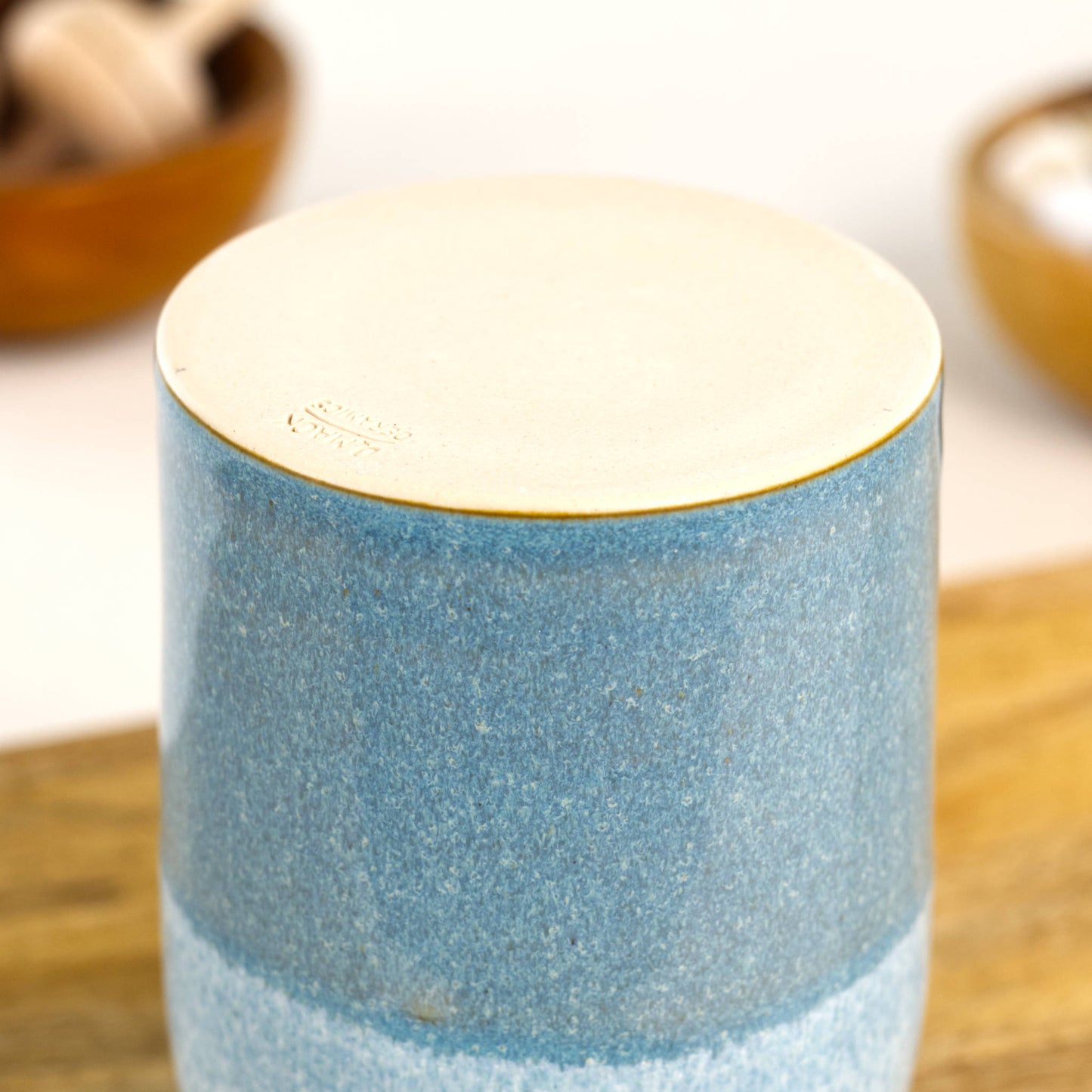 Handmade stoneware reed diffuser base in Coastal Blue and White with burnished unglazed underside and maker’s stamp