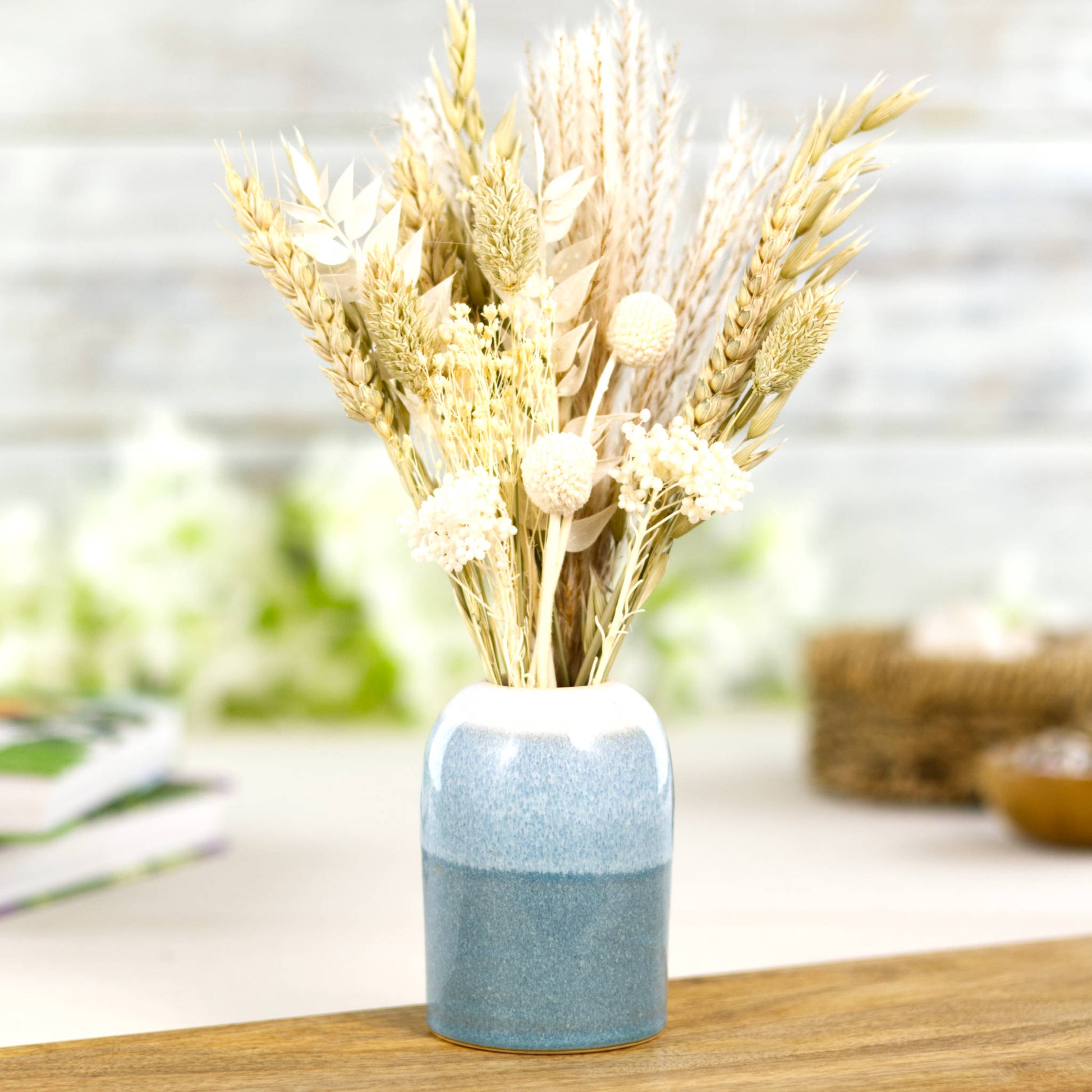 Coastal Blue and White ceramic reed diffuser being used as a bud vase styled with dried flowers, Scandinavian shelf decor accent