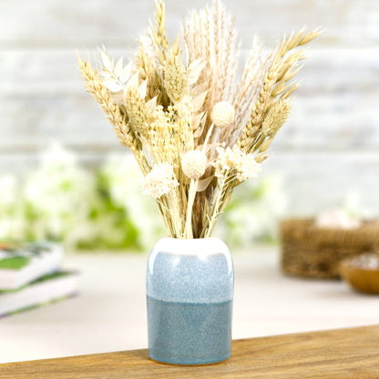 Coastal Blue and White ceramic reed diffuser being used as a bud vase styled with dried flowers, Scandinavian shelf decor accent