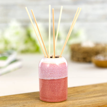 Handmade Coral and White reed diffuser with rattan reeds, spa style bathroom or bedroom accessory