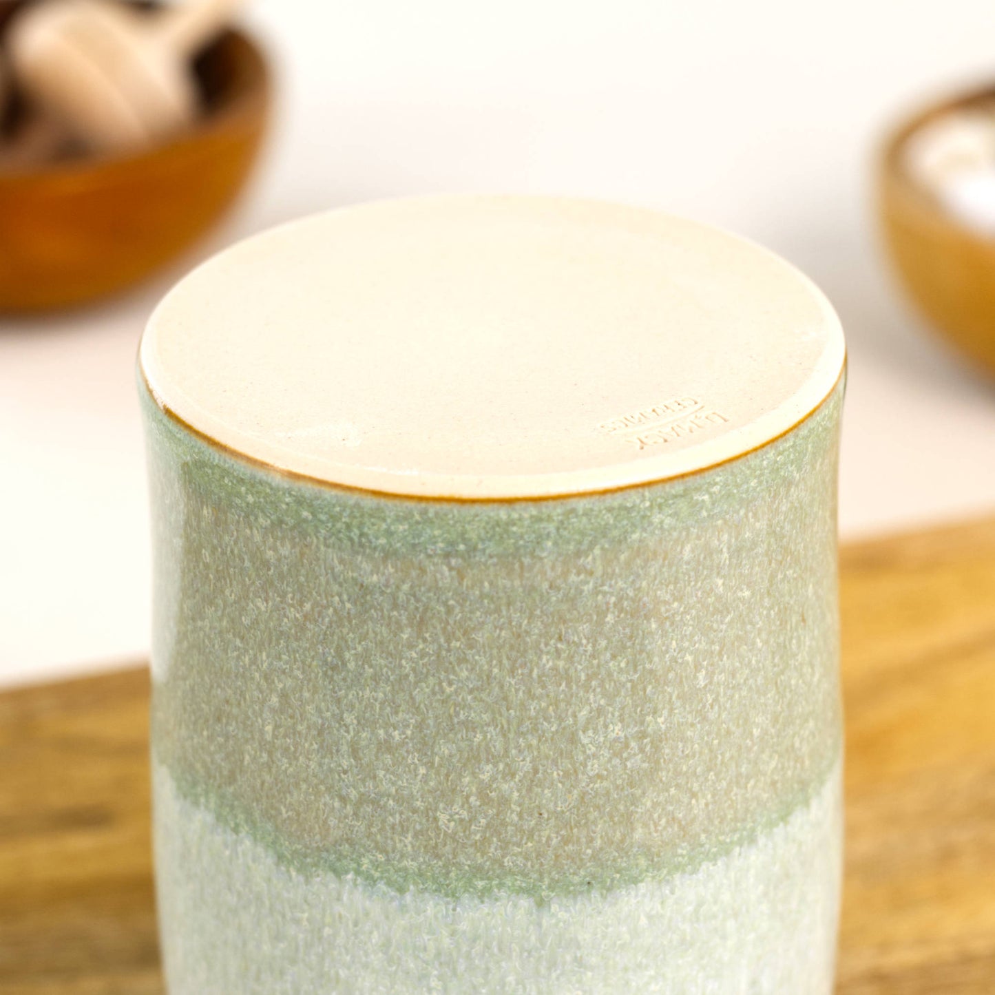 Handmade stoneware diffuser vessel base in Pale Green and White with smooth unglazed underside and impressed maker’s mark