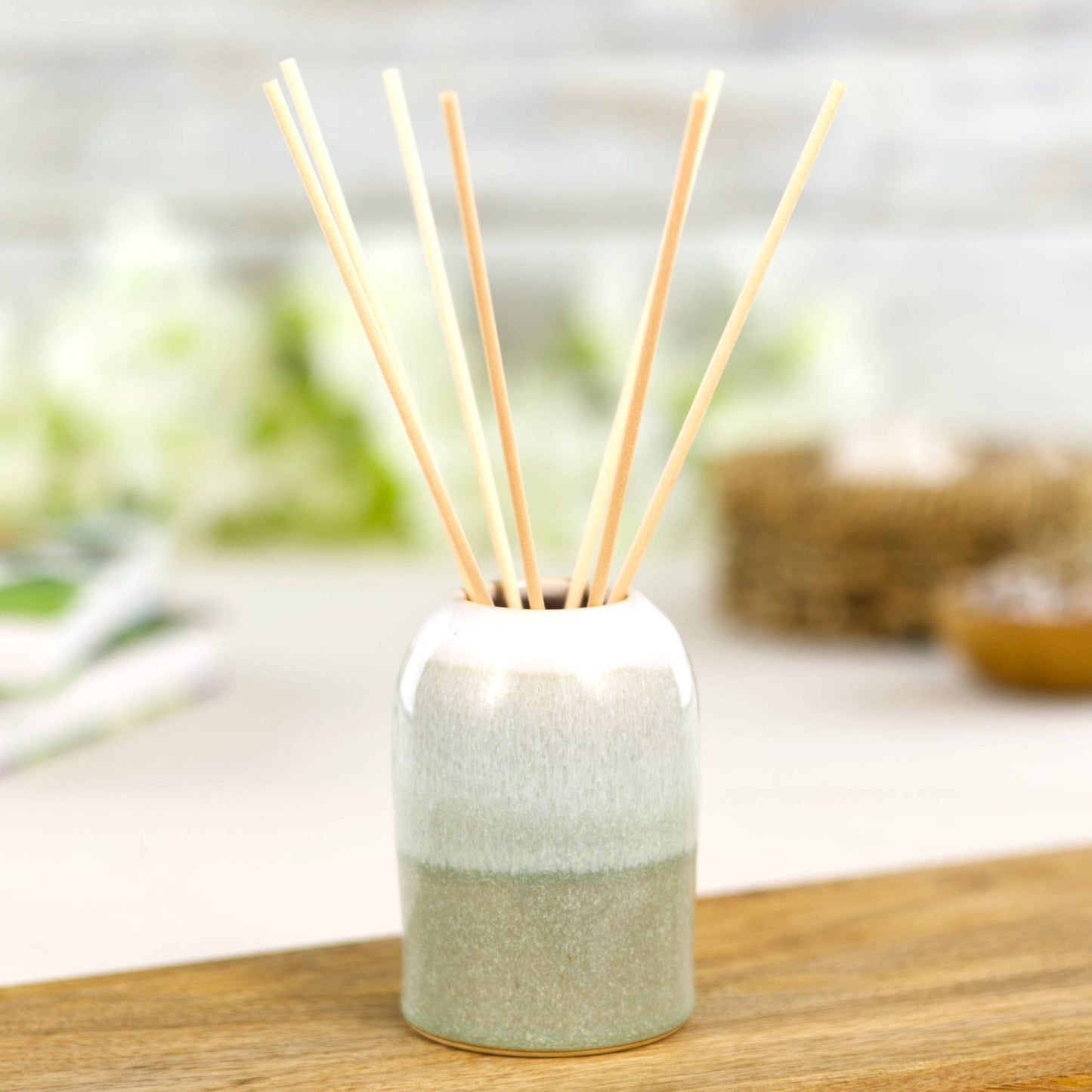 Handmade Pale Green and White reed diffuser with rattan reeds, spa style bathroom or bedroom accessory