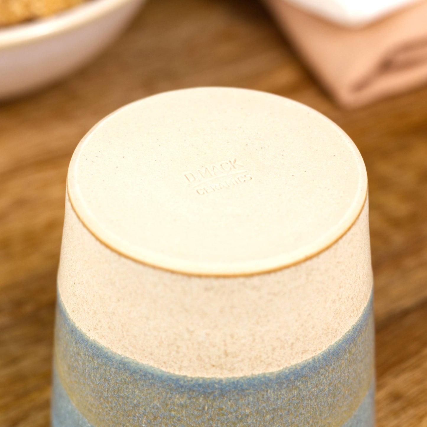Base of espresso cup with smooth burnished clay and maker’s mark from Sussex ceramics studio