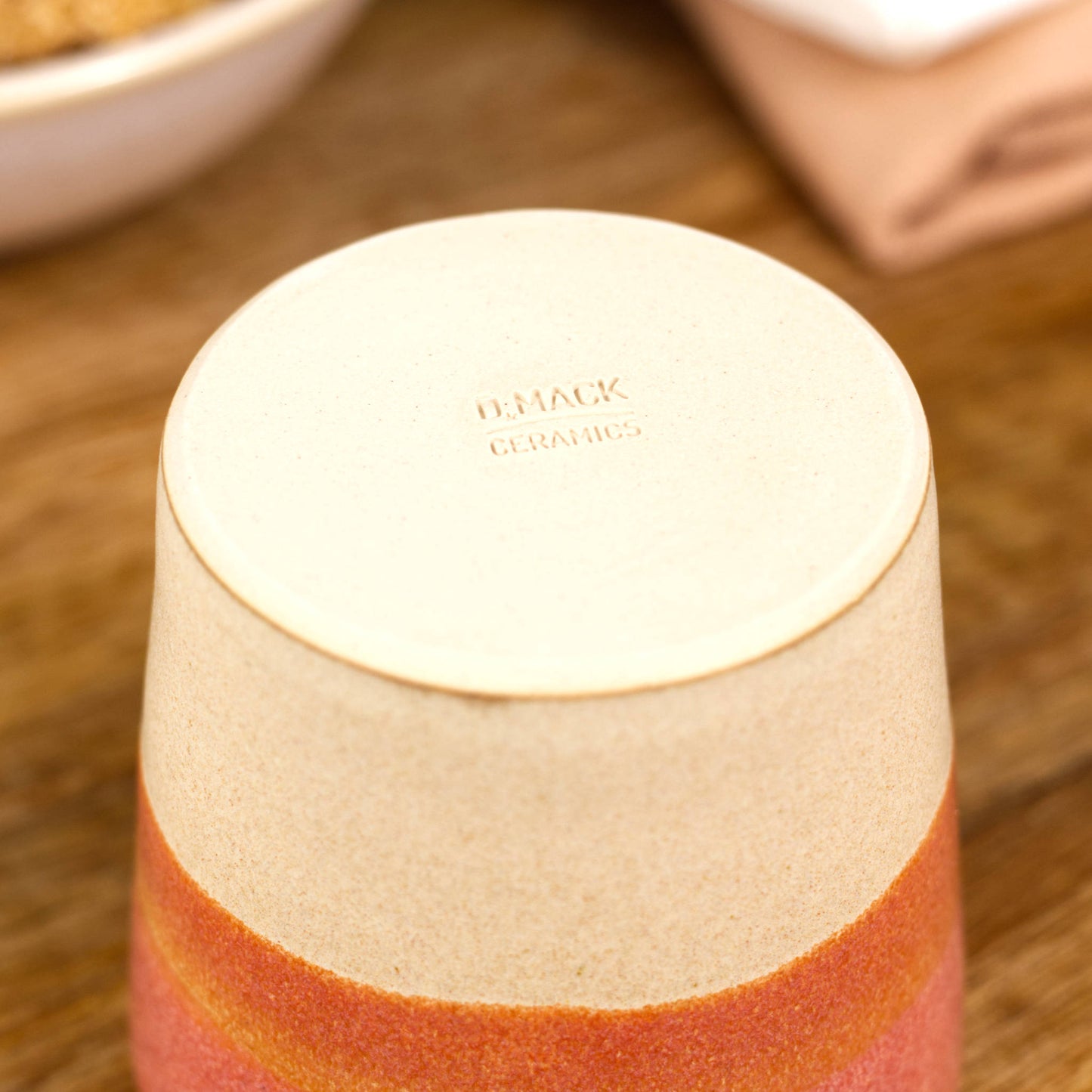 Base of espresso cup with smooth burnished clay and maker’s mark from Sussex studio