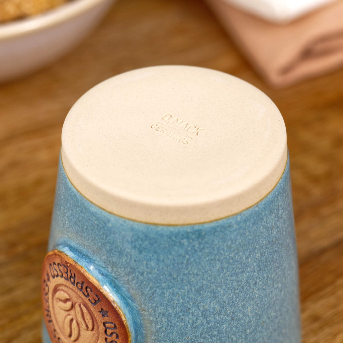 Base of espresso cup with smooth burnished clay and maker’s mark from Sussex studio