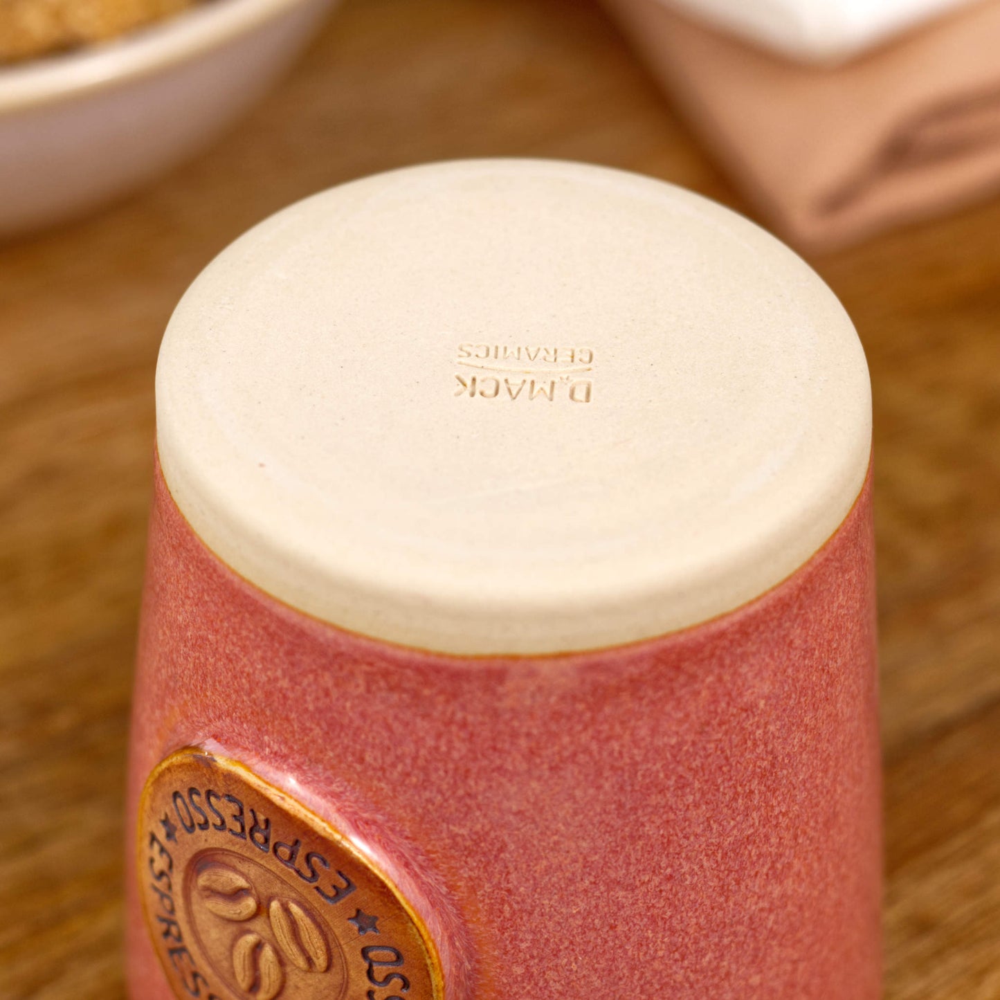 Base of espresso cup with smooth burnished clay and maker’s mark from Sussex studio