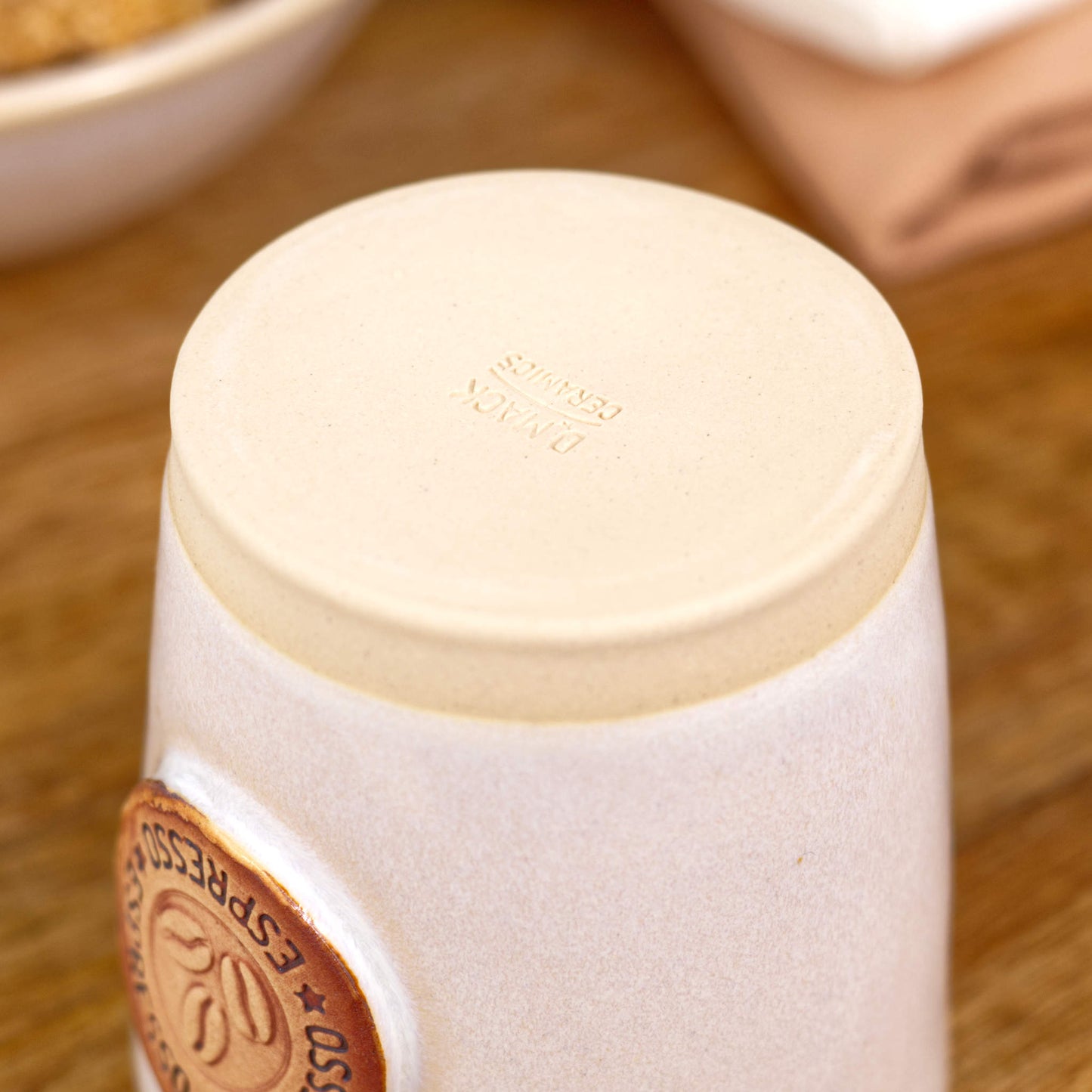 Base of espresso cup with smooth burnished clay and maker’s mark from Sussex studio