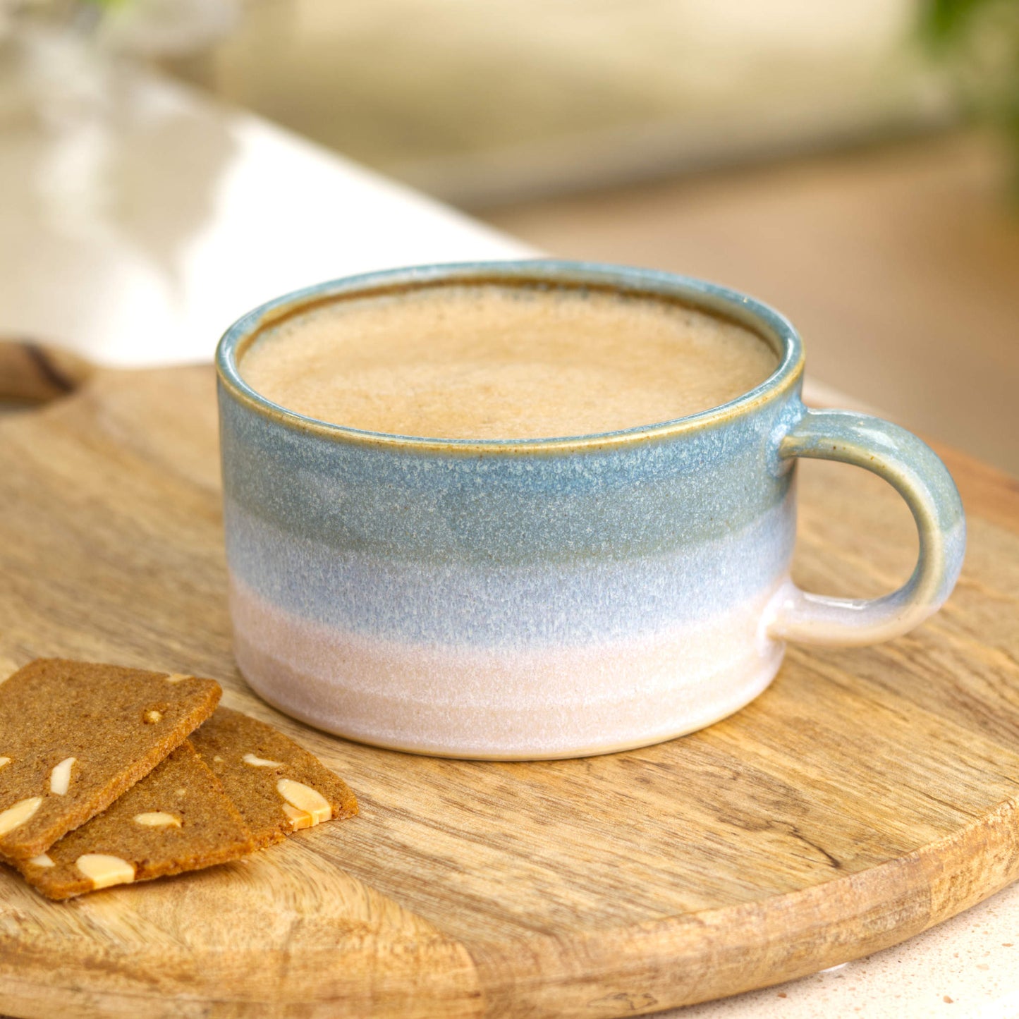 Coastal Blue and White cappuccino cup filled with coffee on wooden board with almond thins, handmade ceramic flat white cup for relaxed mornings