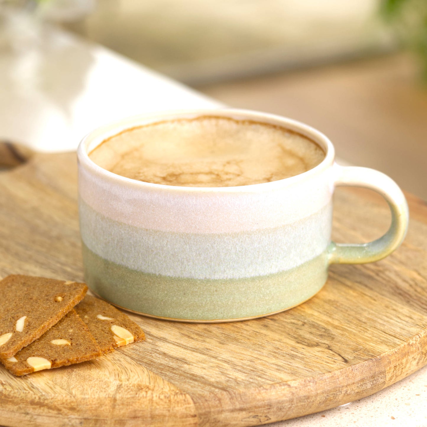 White and Pale Green cappuccino cup filled with coffee on serving board, handmade ceramic cup for cosy morning rituals