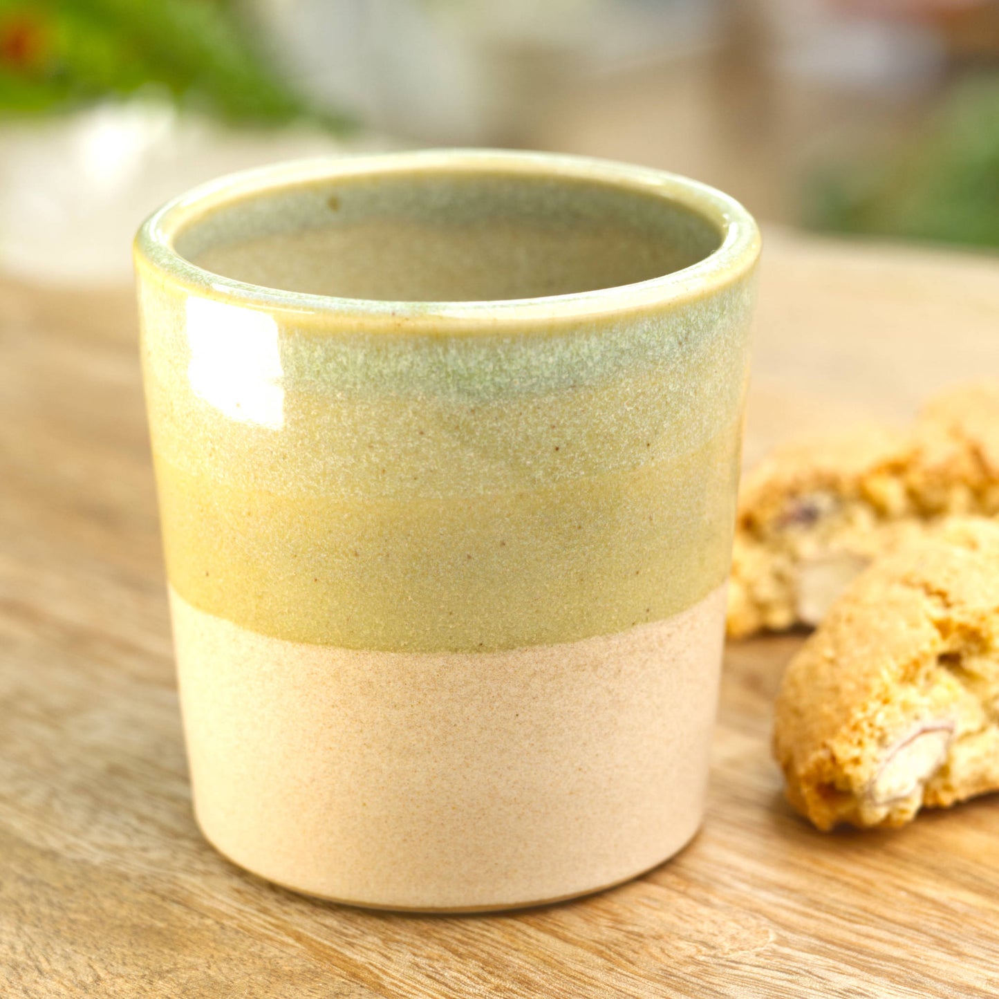 Pale Green two-tone espresso cup styled in kitchen with biscotti for calm coffee moment