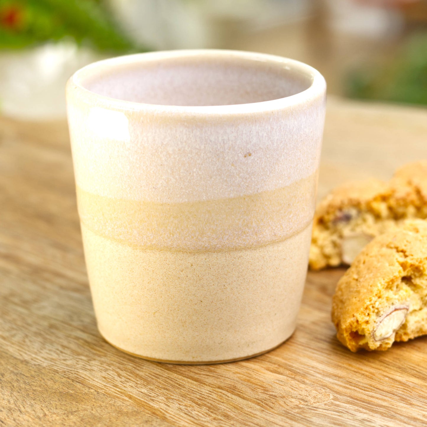 Handmade stoneware espresso cup made in a Sussex studio, with biscotti