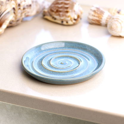 Coastal Blue ceramic soap dish on bathroom windowsill, handmade spiral soap holder for coastal style bathroom decor