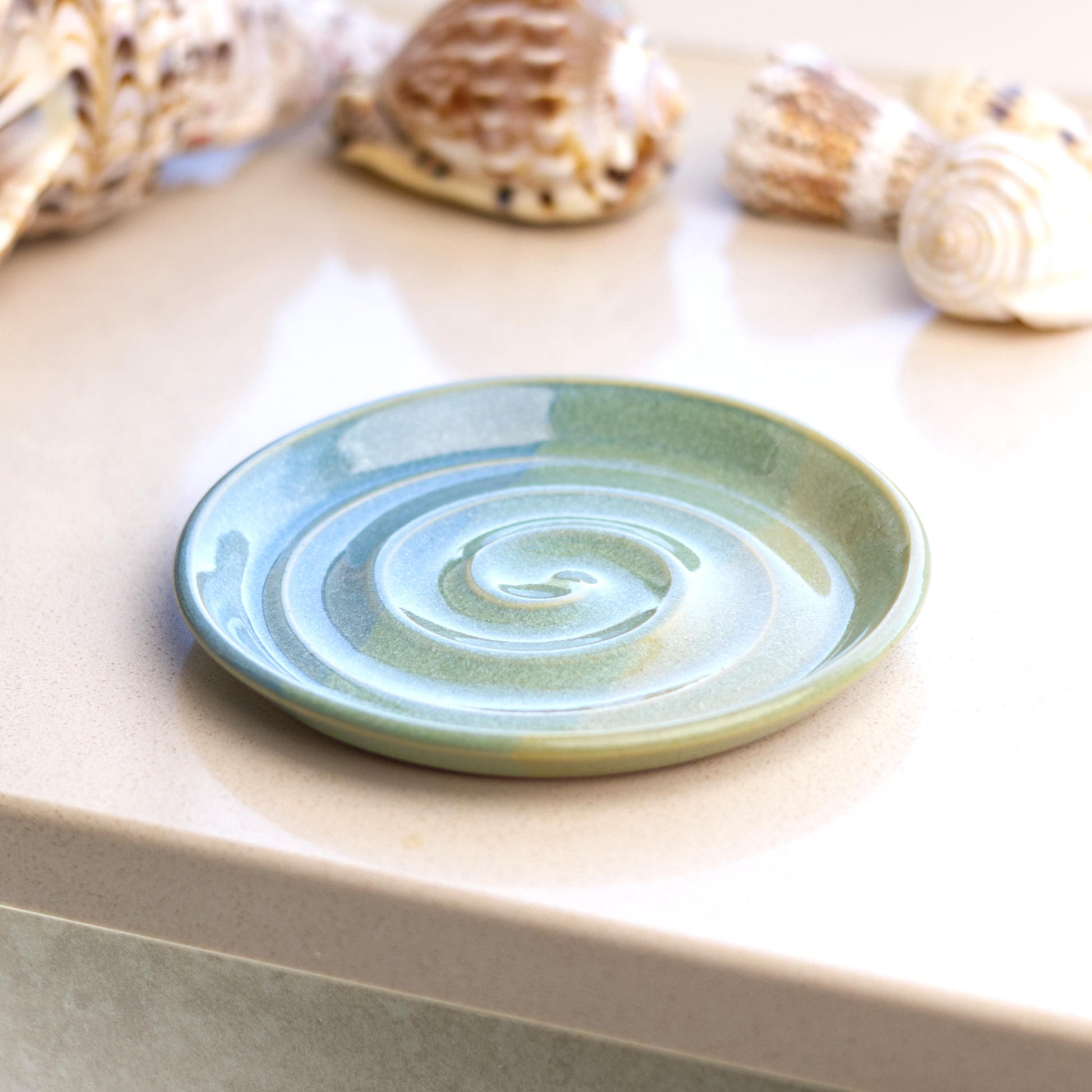 Coastal Blue and Pale Green ceramic soap tray on bathroom windowsill, calming coastal decor for modern wash space