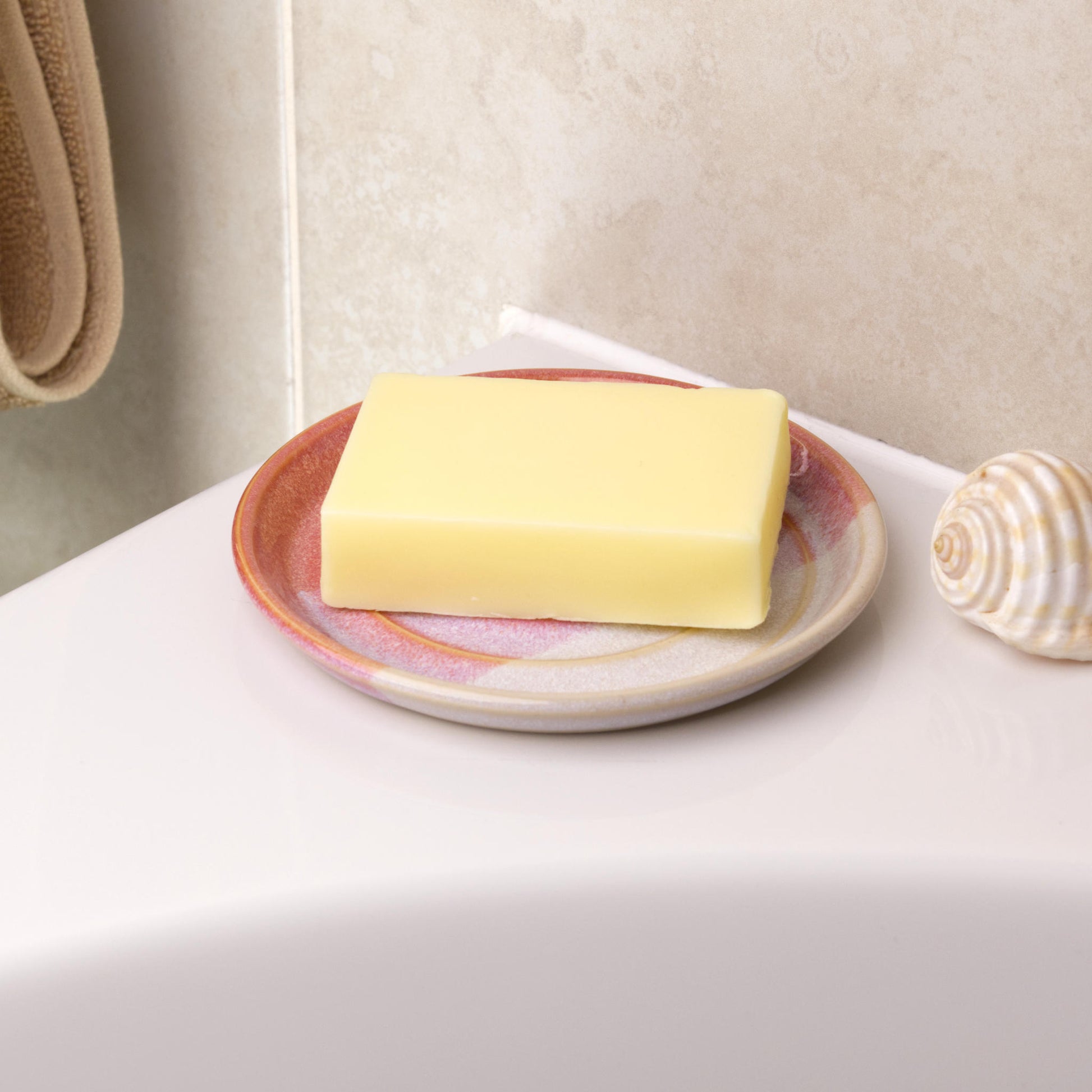 Coral and white soap saver holding cream soap bar, handmade ceramic bathroom decor with soft colour matched tones