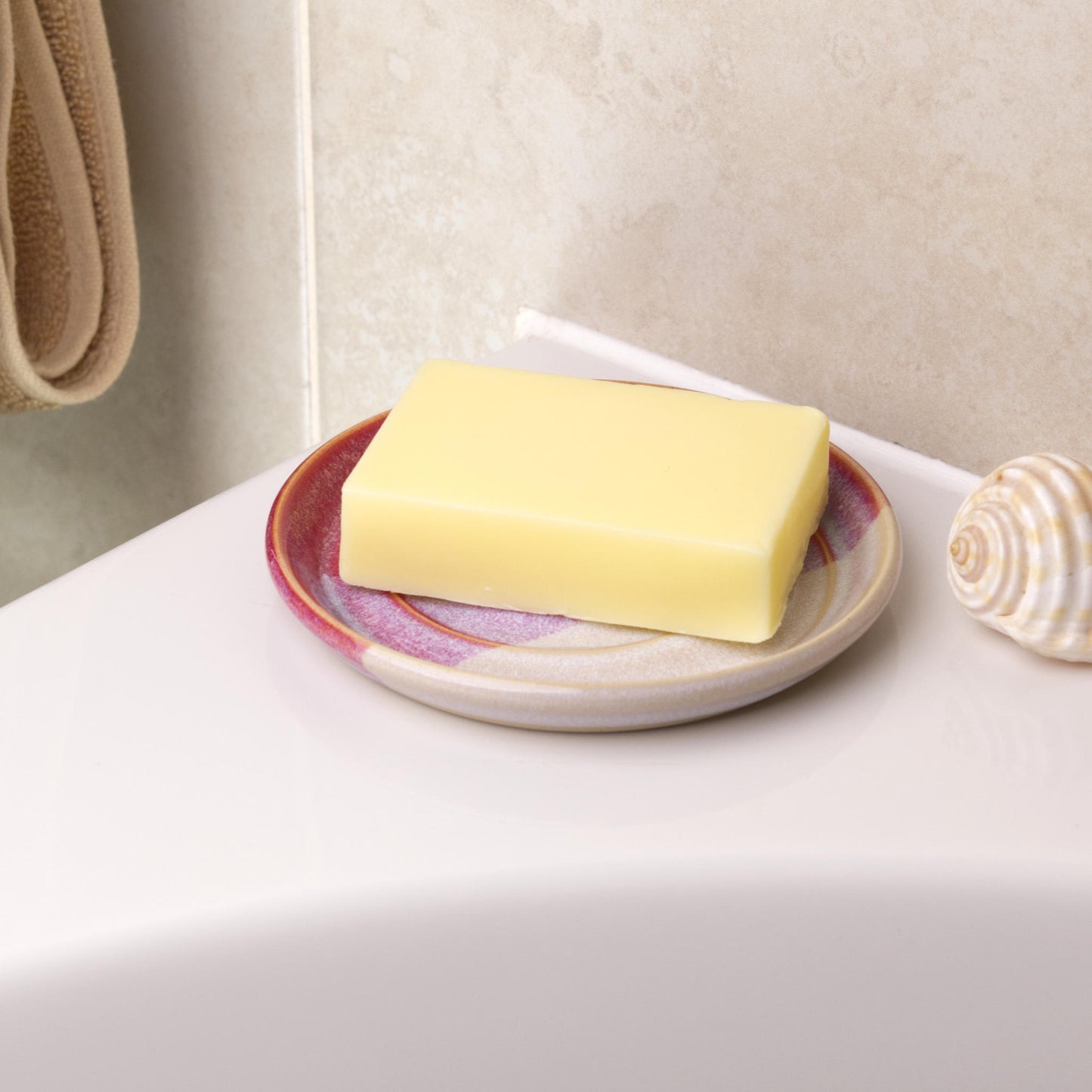 Crimson and white soap saver holding cream soap bar, handmade ceramic bathroom decor with warm colour contrast tones