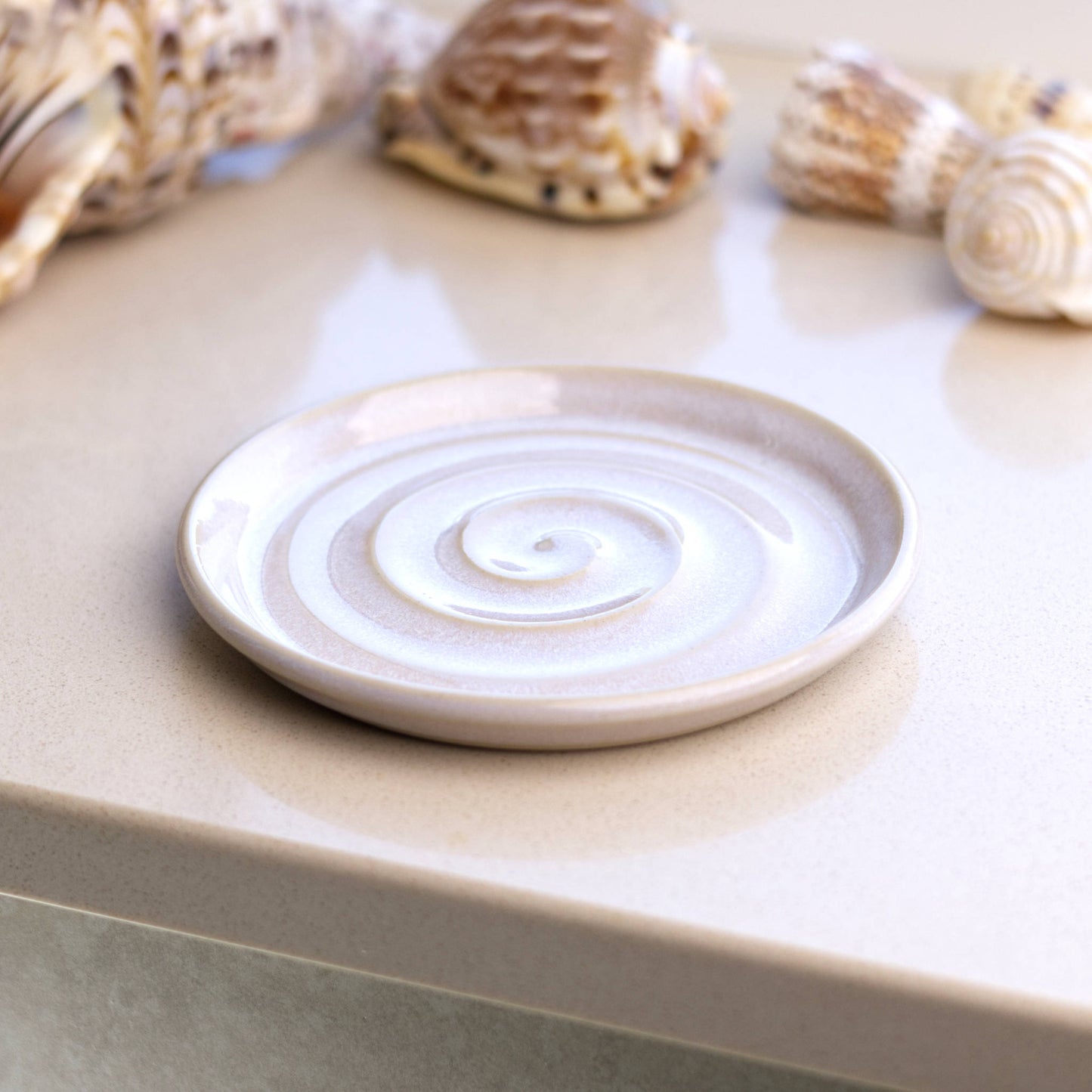 White ceramic soap dish on bathroom windowsill, handmade spiral soap holder for minimalist spa style bathroom décor