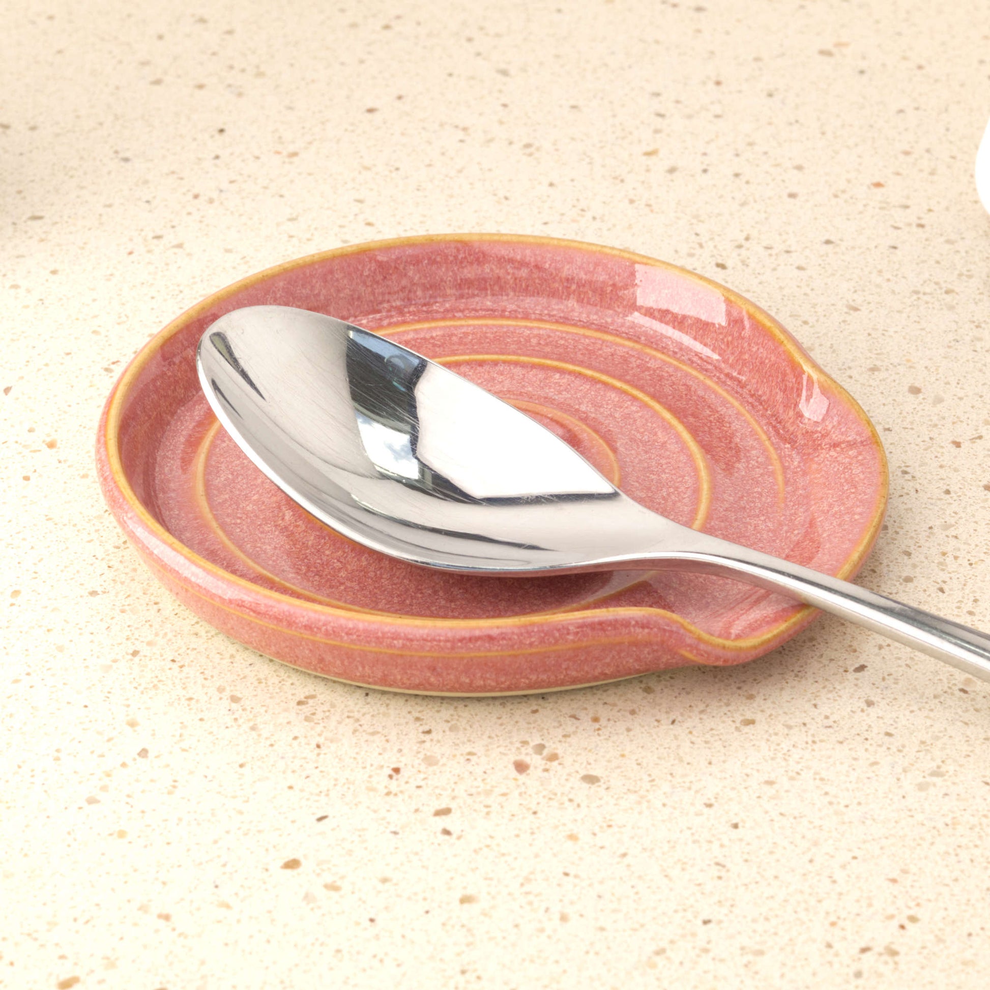 Coral handmade pottery spoon rest holding tablespoon, practical ceramic spoon holder for cooking utensil drips and worktop styling