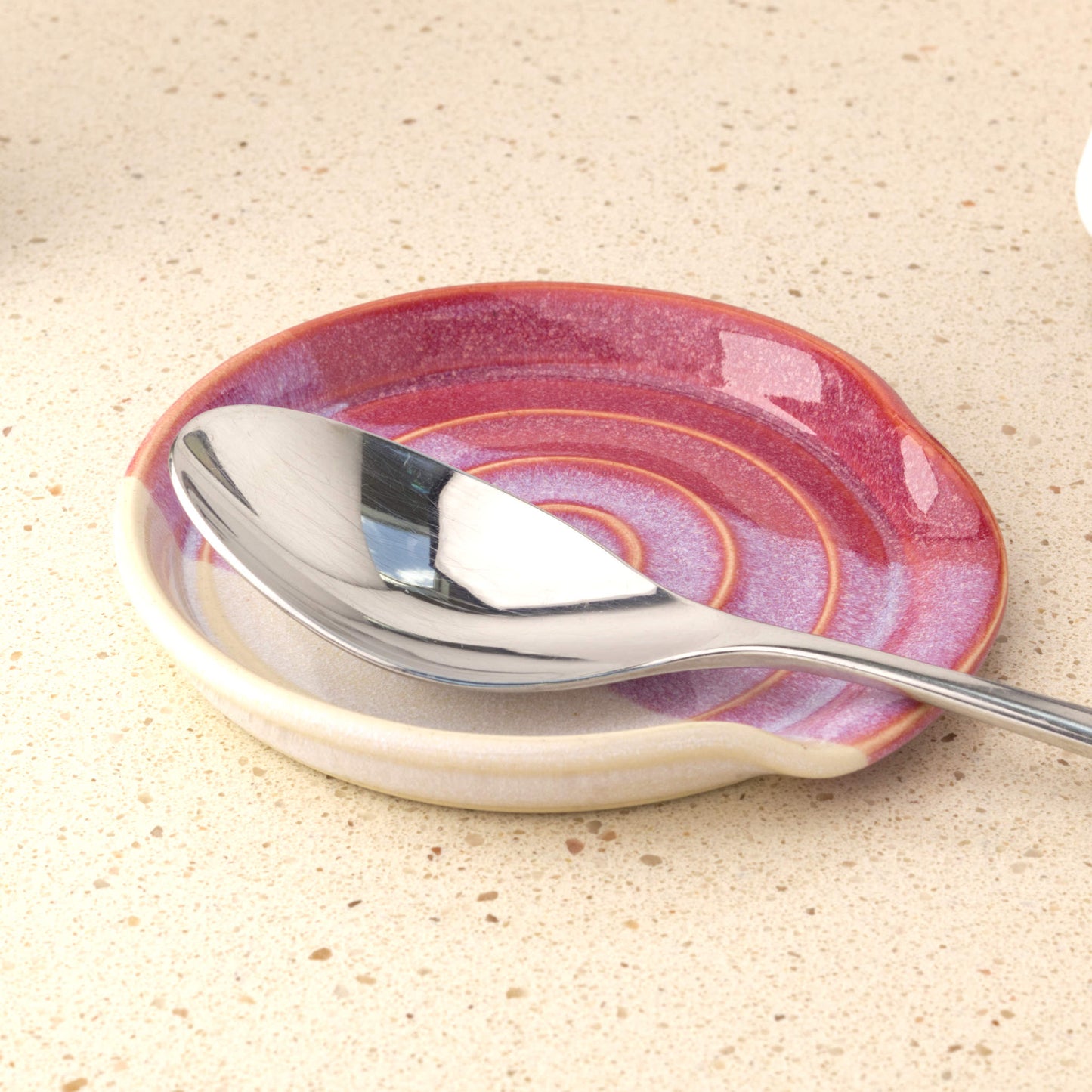 Crimson and white handmade pottery spoon rest holding tablespoon, practical ceramic spoon holder for cooking utensil drips and kitchen styling