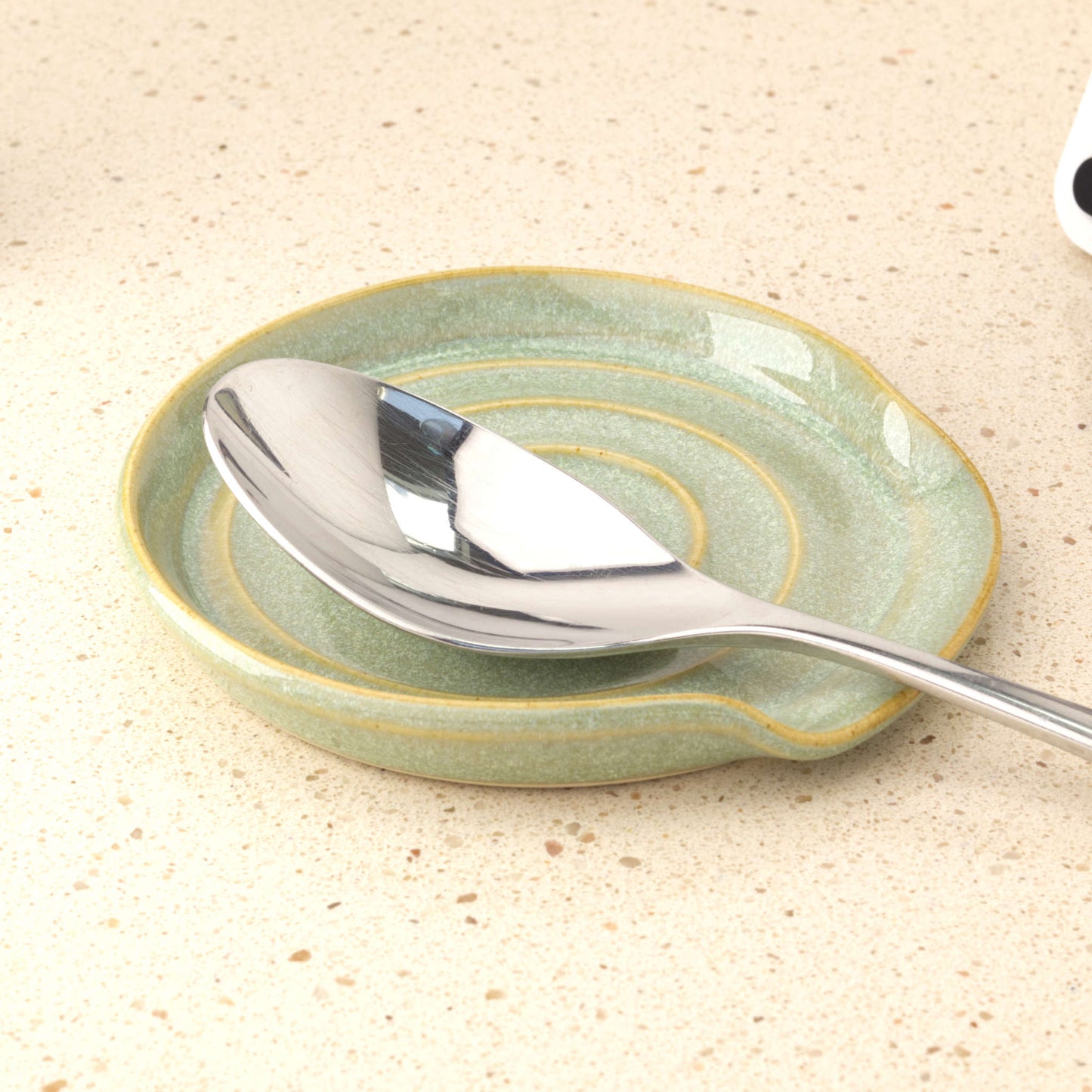 Pale Green handmade pottery spoon rest holding tablespoon, practical ceramic spoon holder for cooking utensil drips and worktop styling