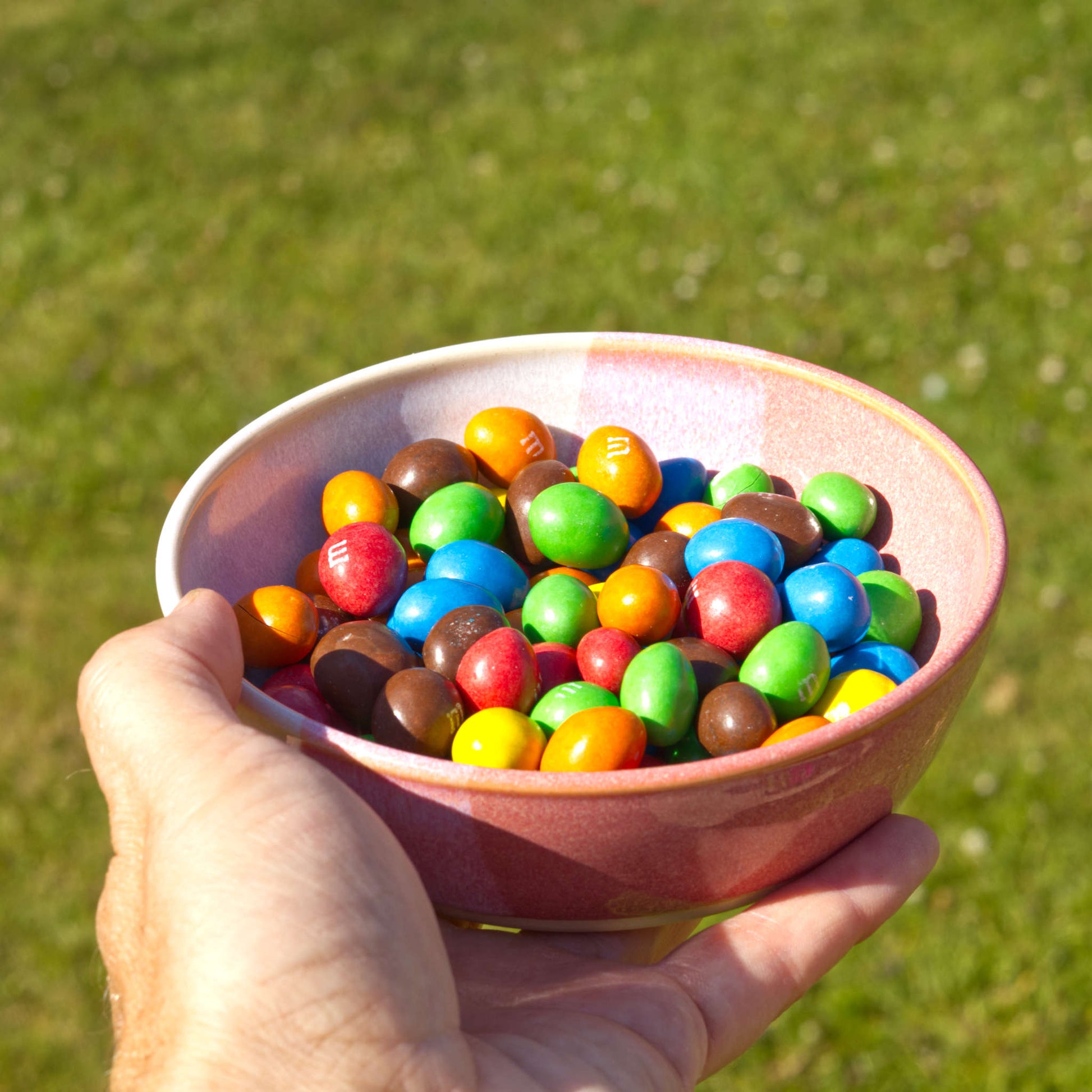 Handmade Coral & White ceramic tapas bowl filled with colourful chocolate sweets, a playful small serving bowl for treats, sharing snacks, parties and family gatherings