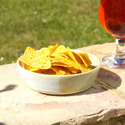 Pale Green & White handmade tapas bowl filled with tortilla chips, styled outdoors for garden entertaining, BBQ nibbles, party snacks and relaxed summer sharing