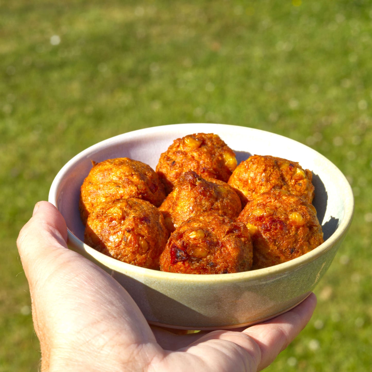 Handmade Pale Green & White ceramic tapas bowl held in the hand and filled with falafel, ideal for mezze, appetisers, picky bits and Mediterranean-style alfresco dining