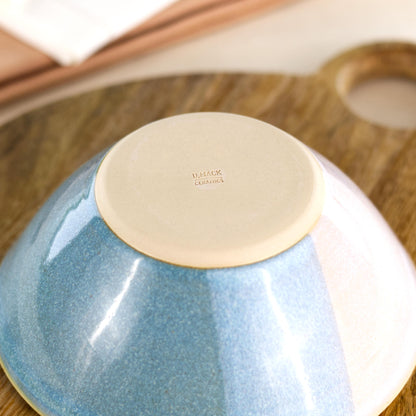 Base of Coastal Blue and White handmade medium bowl showing my maker’s mark and smooth burnished base, designed to help reduce surface scratching
