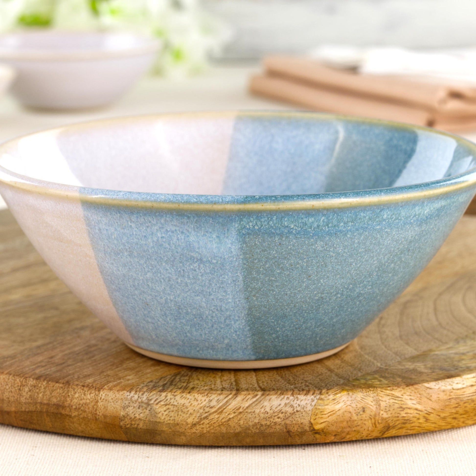 Close-up of Coastal Blue and White double-dipped Sea Smoothed Pebble glaze on a wheel-thrown stoneware bowl, showing soft speckling and handmade texture