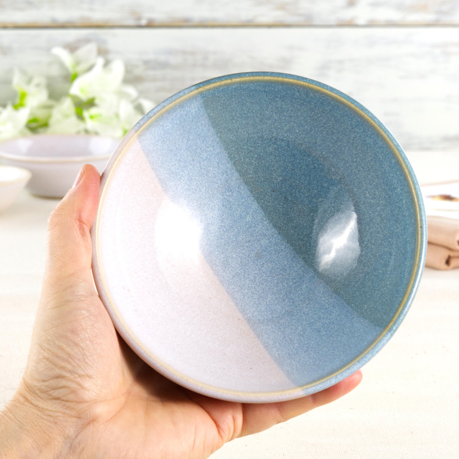 Coastal Blue and White handmade ceramic bowl held in hand, a medium stoneware bowl for cereal, porridge, soup, noodles and cosy everyday meals