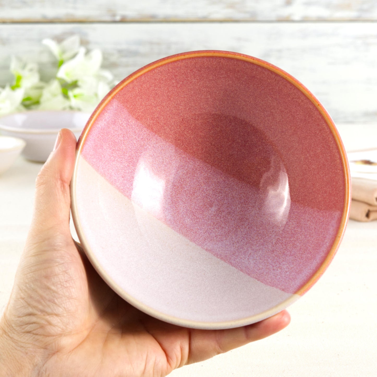 Coral and White handmade ceramic bowl held in hand, a medium breakfast bowl for cereal, porridge, yoghurt, fruit and weekend brunch