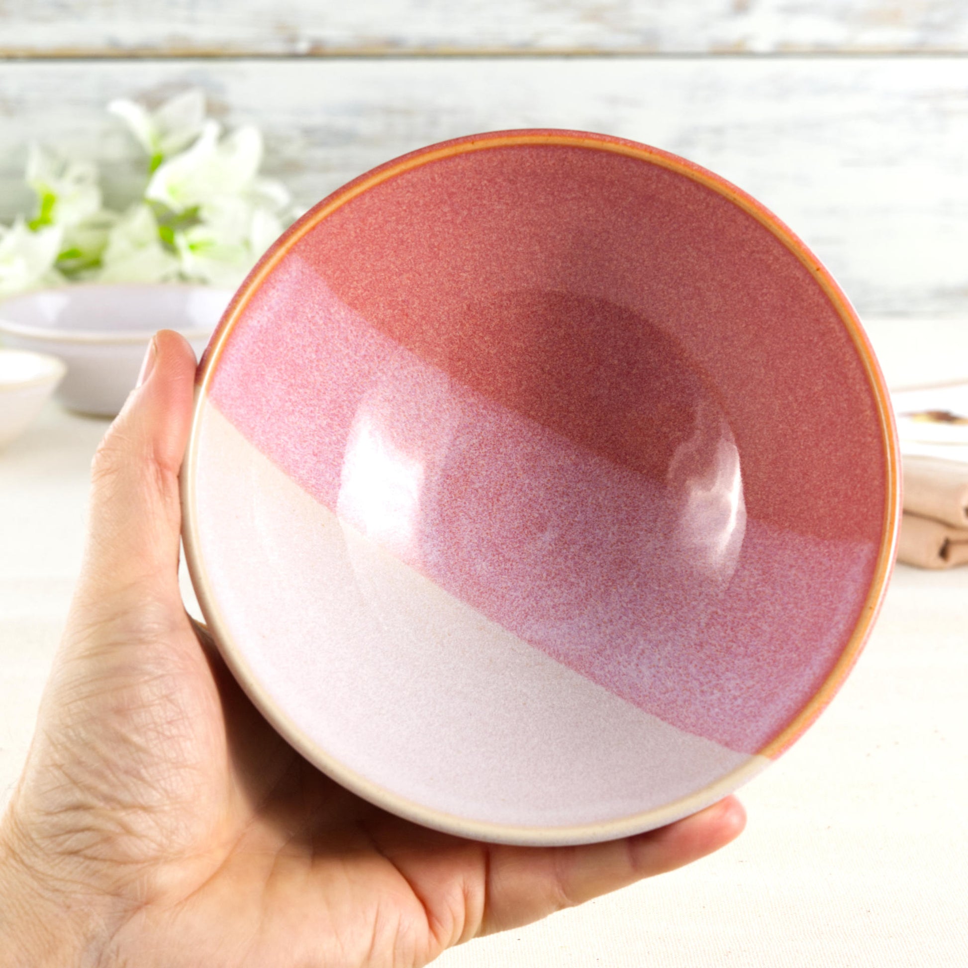 Coral and White handmade ceramic bowl held in hand, a medium breakfast bowl for cereal, porridge, yoghurt, fruit and weekend brunch