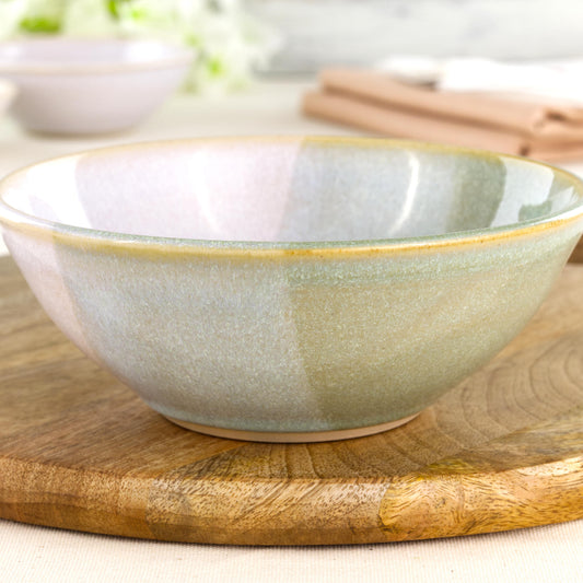 Close-up of Pale Green and White double-dipped Sea Smoothed Pebble glaze on a wheel-thrown stoneware bowl with soft natural speckling