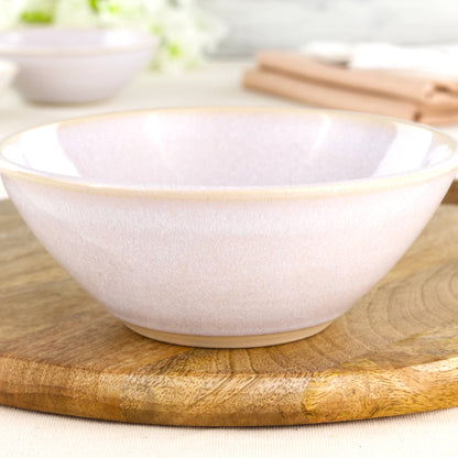 Close-up of a wheel-thrown white stoneware bowl with a glossy speckled glaze, soft minimalist finish and simple Scandi-style ceramic texture