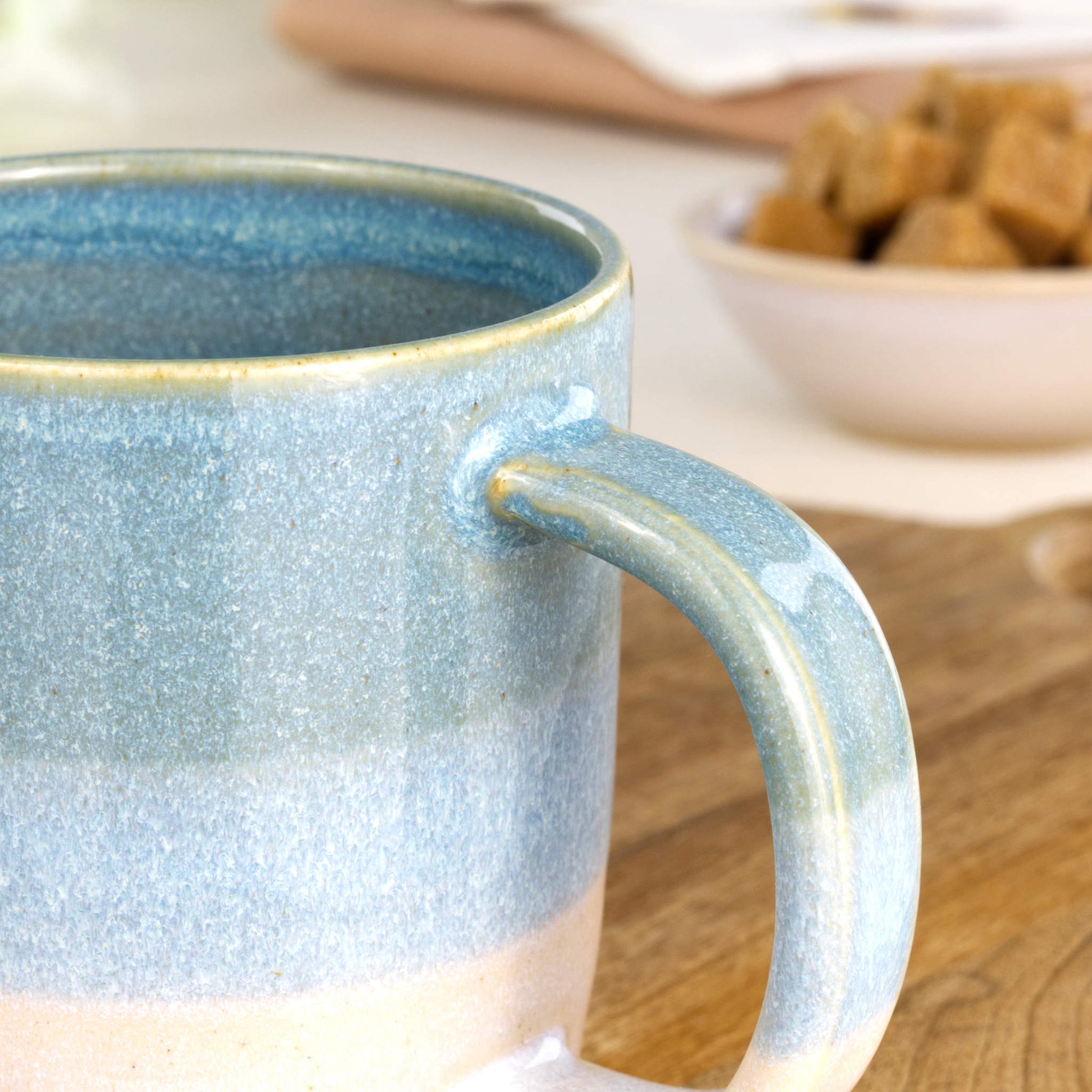 Close-up of Coastal Blue Sea Smoothed Pebble glaze on handmade pottery mug from a small studio