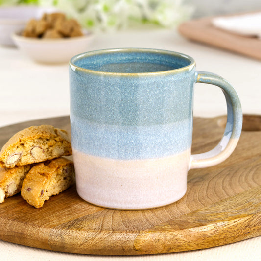 Coastal Blue and White ceramic mug styled with biscotti on wooden board for a handmade coffee moment