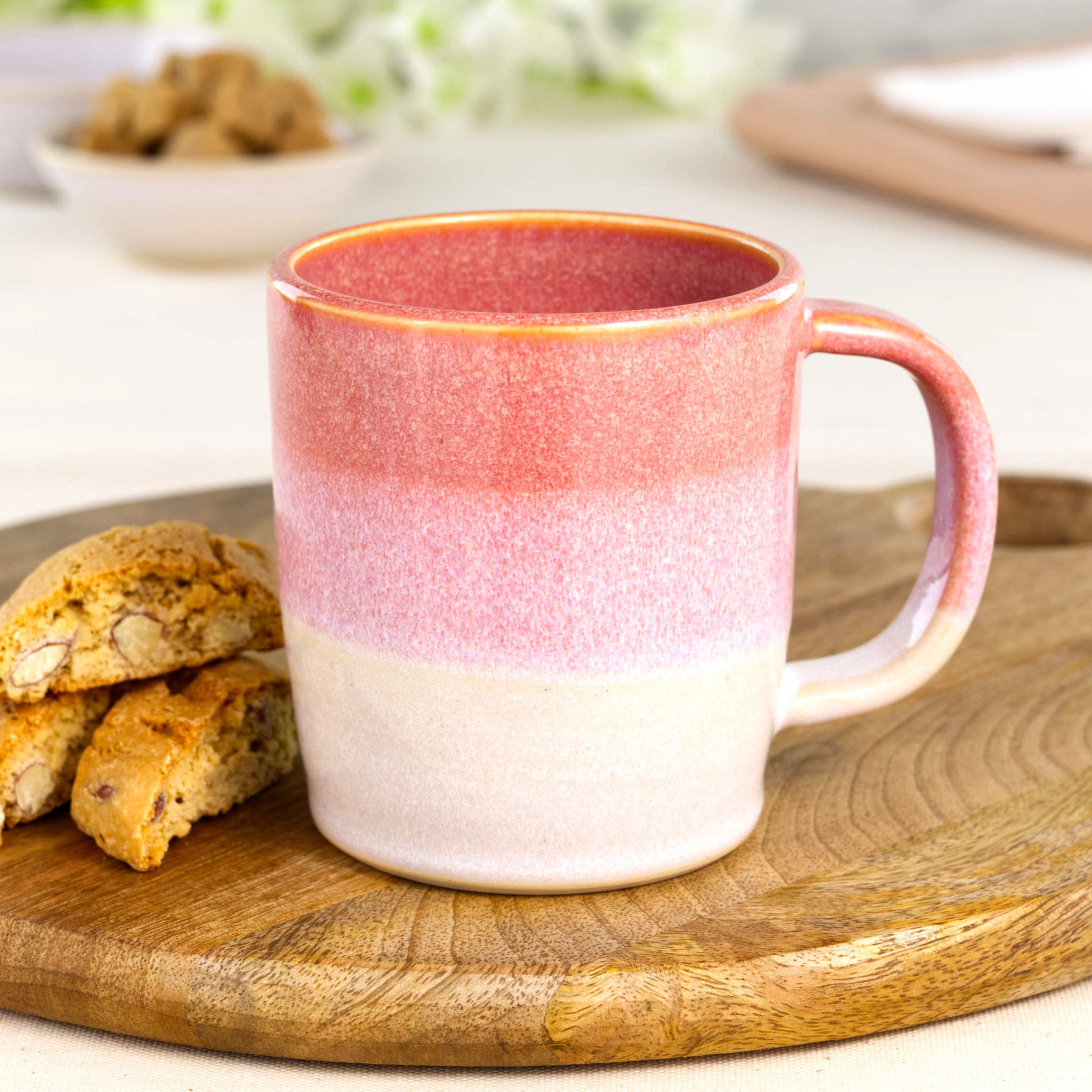 Coral and White handmade ceramic mug on a wooden board with biscotti, a wheel-thrown stoneware coffee mug for cosy everyday use
