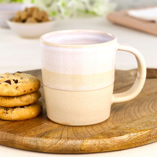 White and Sand artisan ceramic hot chocolate mug on a wooden board with cookies, a cream and beige handmade mug with rustic scandi charm from my small UK studio