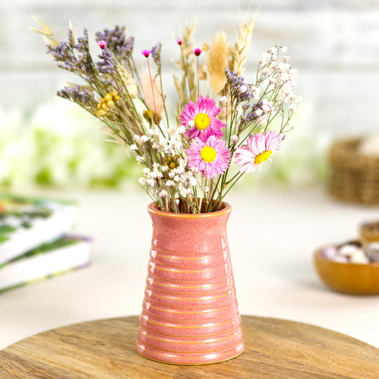 Coral ribbed ceramic bud vase filled with colourful dried flowers, perfect for cheerful home styling. Cottagecore decor.
