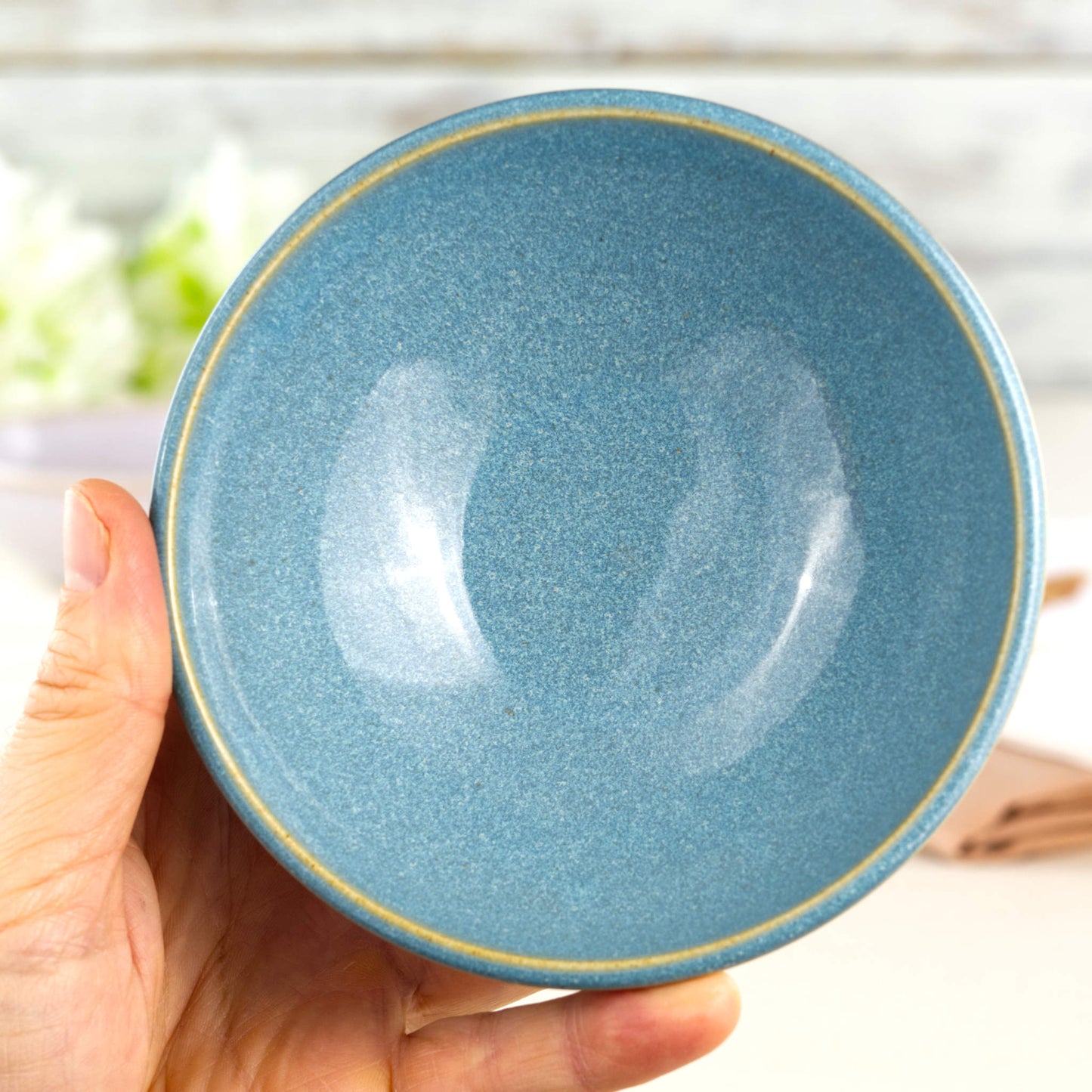 Coastal Blue handmade small bowl held in hand, showing rounded snack bowl shape for olives, dips, nuts and little desserts