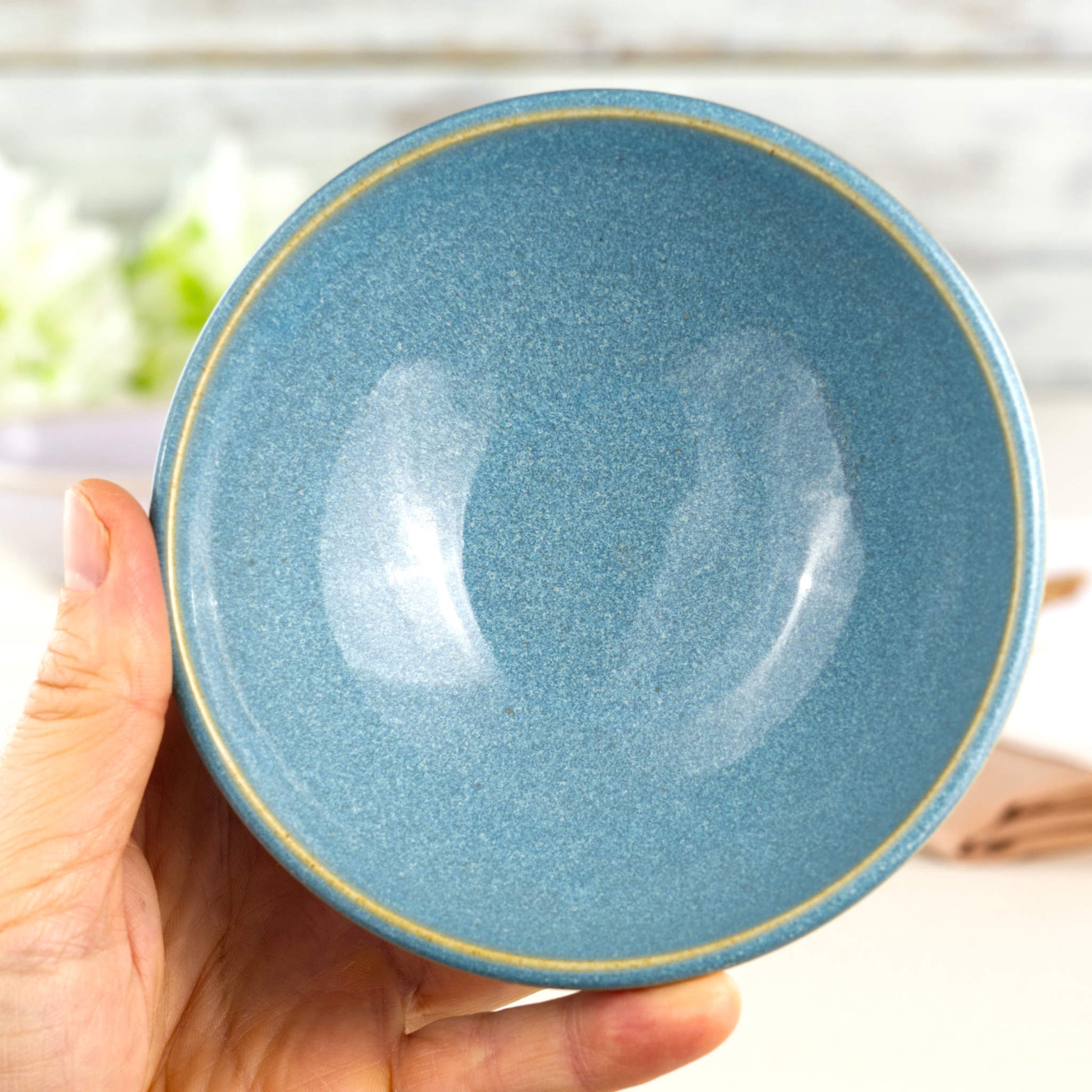 Coastal Blue handmade small bowl held in hand, showing rounded snack bowl shape for olives, dips, nuts and little desserts