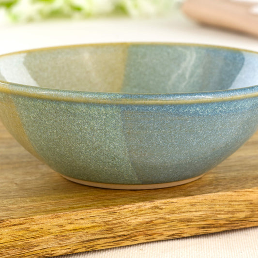 Close-up of Blue and Green double-dipped Sea Smoothed Pebble glaze on a wheel-thrown stoneware bowl, showing the soft two-tone finish and gently speckled handmade texture