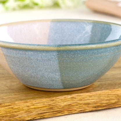Close-up of double-dipped Coastal Blue and White Sea Smoothed Pebble glazes on a wheel-thrown stoneware snack bowl
