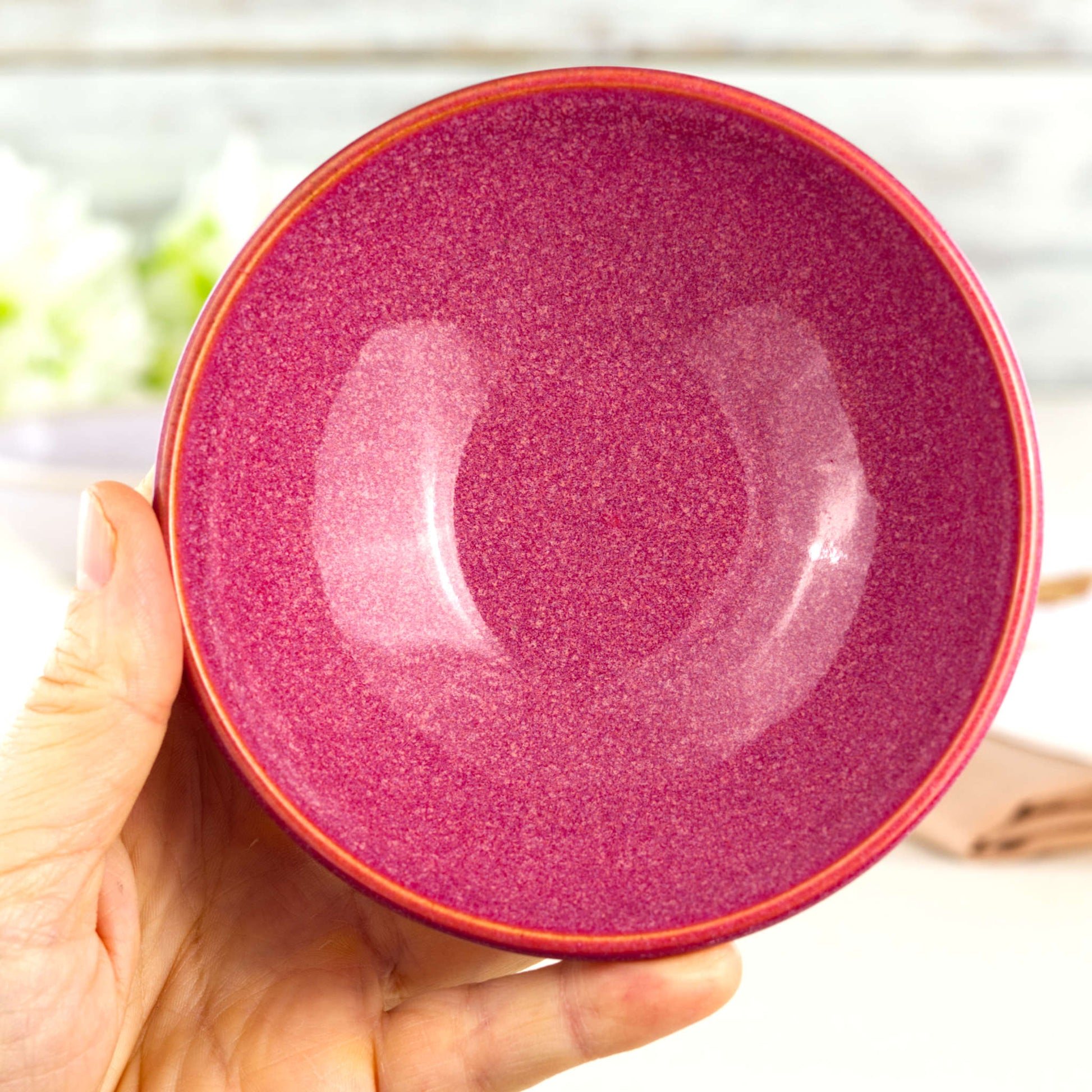 Crimson handmade small bowl held in hand, showing rounded form for dips, chutneys, sauces and after-dinner treats